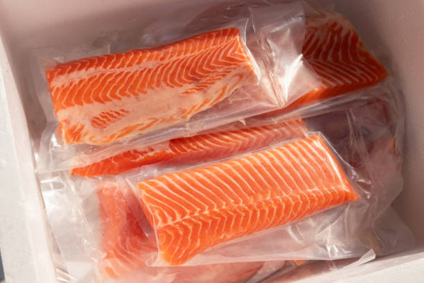 istock Fresh salmon fillets in vacuum-sealed packaging. 2196403994
