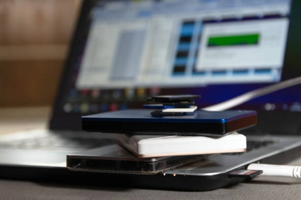 Modern gadgets on a desk with laptop background