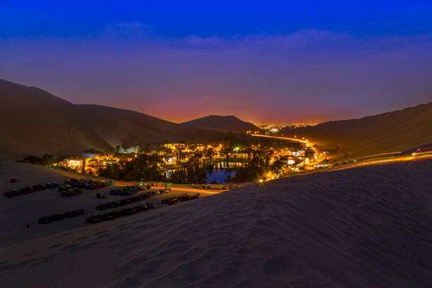 istock Huacachina oasis shining at night in the peruvian desert 2196405169