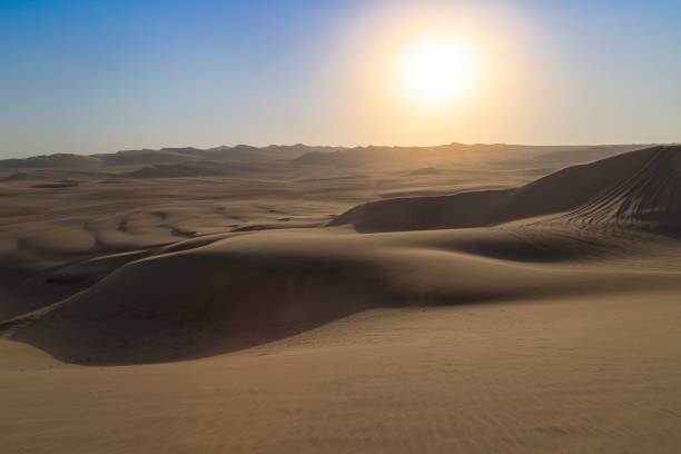 istock Sun shining over the huacachina desert in peru 2196405603
