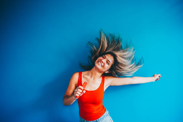 istock Woman listeting to music 2196407355