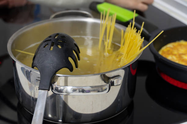 Cooking Spaghetti in a Pot on the Stove