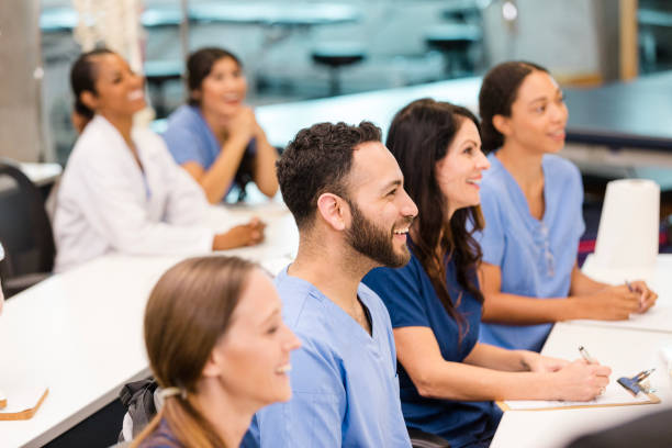 istock Diverse Group of Medical Students Attentively Listening in Class 2196411319
