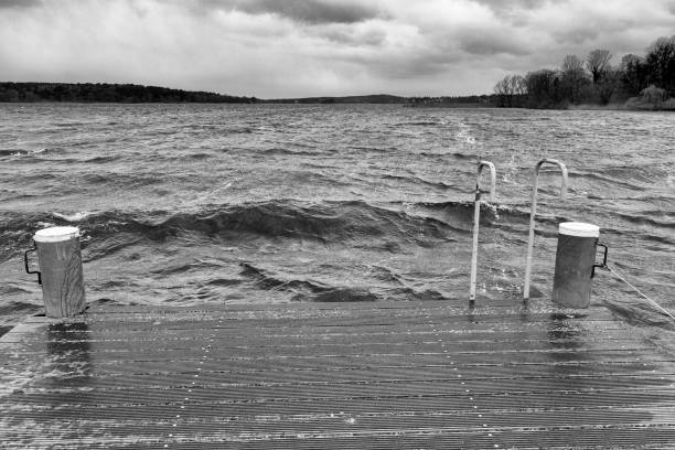 Jetty on a lake in a storm with rough waves