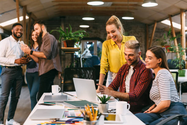 istock Team Members Collaborating and Enjoying Moments at a Modern Workspace During the Day 2196416333