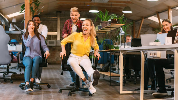 istock Team Members Enjoying a Fun Moment in a Vibrant Office Environment During Work Hours 2196416348