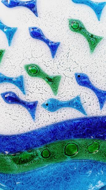 istock Glass backgrounds with fish figures in blue and green colors. 2196418638