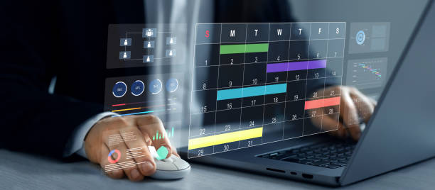 istock Businessman manages time to work efficiently and on time on all projects. Calendar work schedule, business plan concept.Managing a scheduled meeting. 2196419269