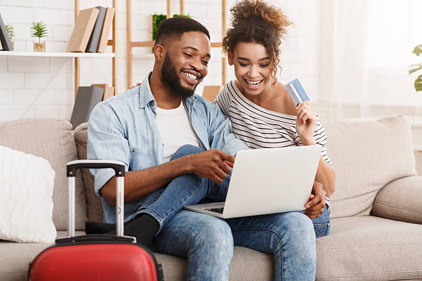 istock Romantic couple preparing for travel, using laptop 2196419739