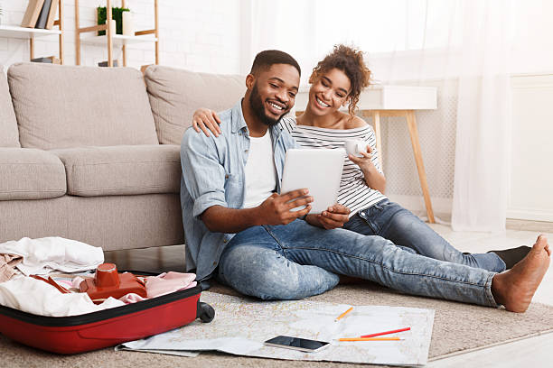 istock Young couple planning vacation trip on tablet 2196419743