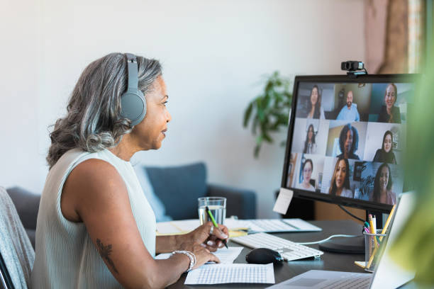 istock Mature Woman in Video Conference Meeting, Using Laptop 2196422492