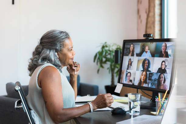 istock Mature Woman in Video Conference with Diverse Team 2196422500