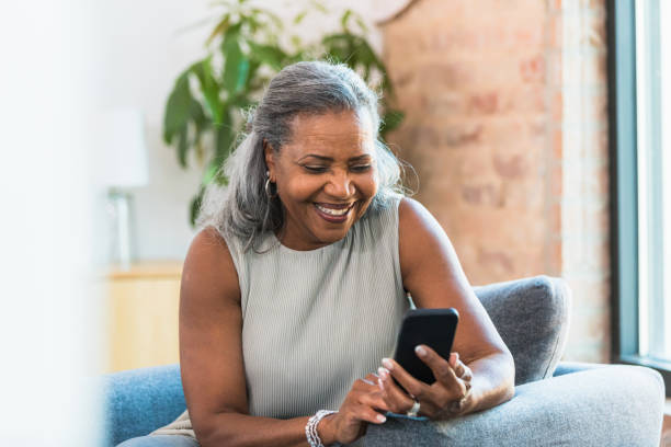 istock Happy Mature Woman Using Smartphone, Smiling 2196422508