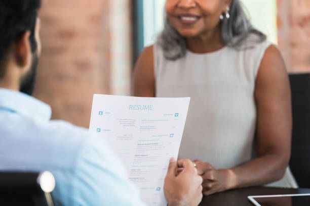 istock Job Interview: Candidate Reviews Resume with Recruiter 2196422542