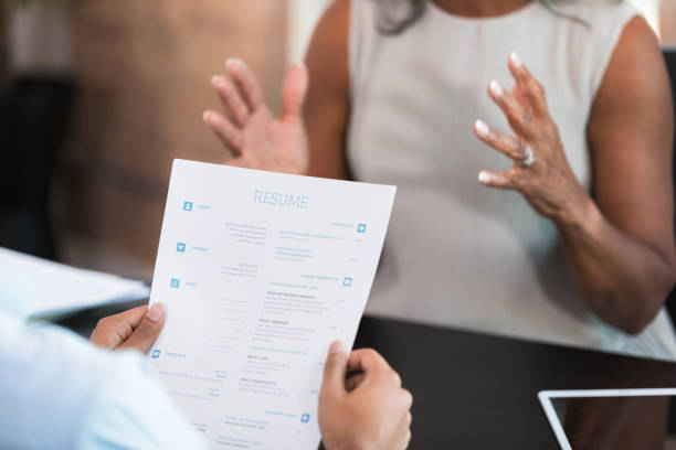 istock Job Interview: Candidate Shows Resume to Recruiter 2196422550