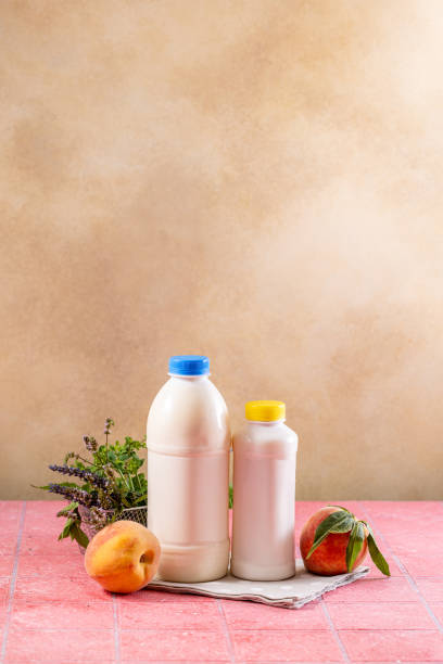 Homemade kefir fermentation container with kefir grains and milk covered with sterile gauze - homemade healthy dairy products