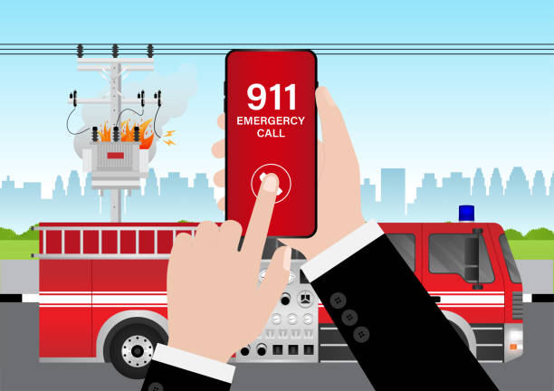 istock 911 Emergency Call for Fire Truck about Burning House and Burning Building. Hand Holding Smartphone with 911 Emergency Call. 2196427711