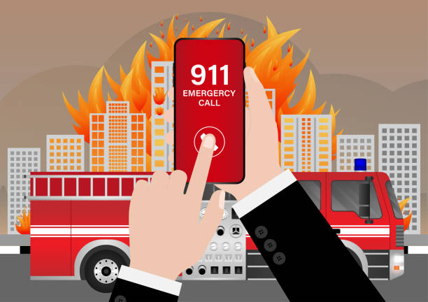 istock 911 Emergency Call for Fire Truck about Burning House and Burning Building. Hand Holding Smartphone with 911 Emergency Call. 2196427733