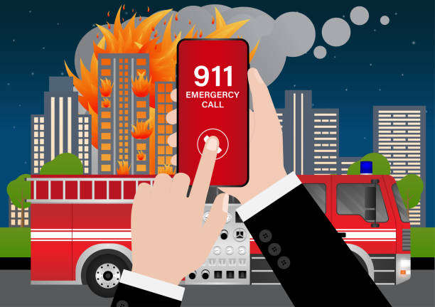 istock 911 Emergency Call for Fire Truck about Burning House and Burning Building. Hand Holding Smartphone with 911 Emergency Call. 2196427734