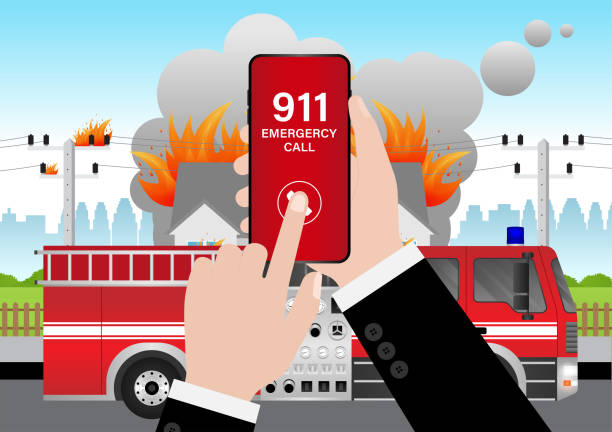 istock 911 Emergency Call for Fire Truck about Burning House and Burning Building. Hand Holding Smartphone with 911 Emergency Call. 2196428269