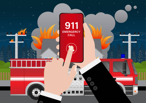 istock 911 Emergency Call for Fire Truck about Burning House and Burning Building. Hand Holding Smartphone with 911 Emergency Call. 2196428273