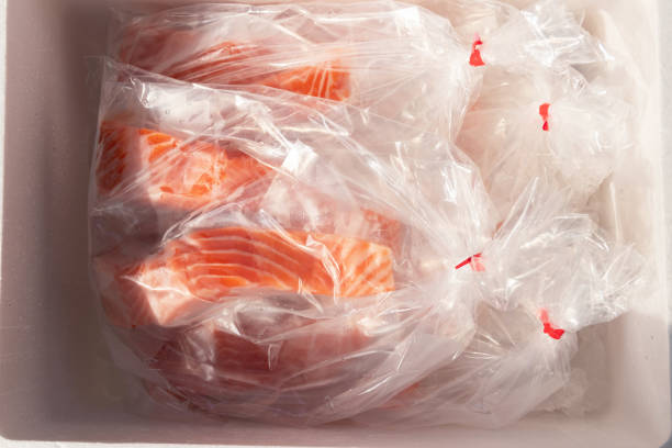 istock Fresh salmon fillets wrapped in plastic. 2196430769