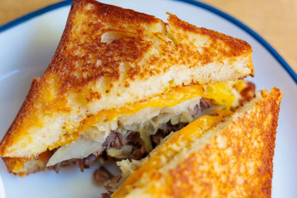istock Grilled cheese sandwich with savory beef and cabbage on a white plate 2196430814