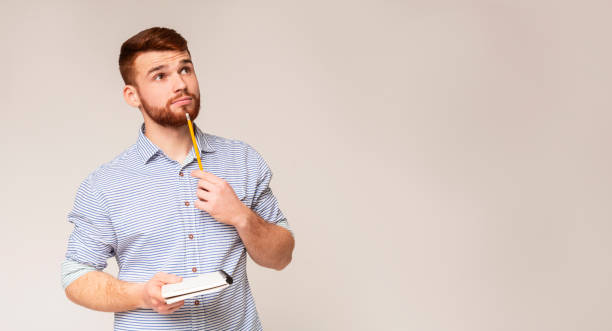 istock Young man thinking about checklist what to do 2196431620