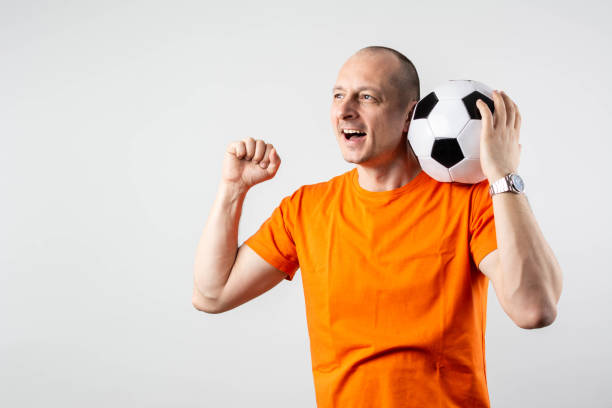 istock excited men watch football match 2196432976