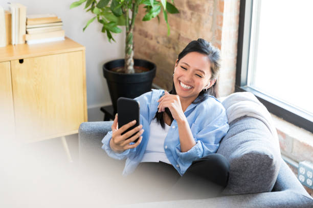 istock Happy Young Woman Using Smart Phone, Toothy Smile 2196433272