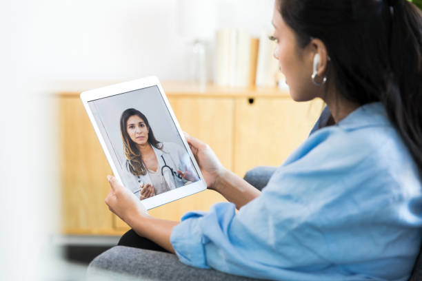 istock Virtual Doctor Appointment: Woman using tablet for telehealth 2196433283