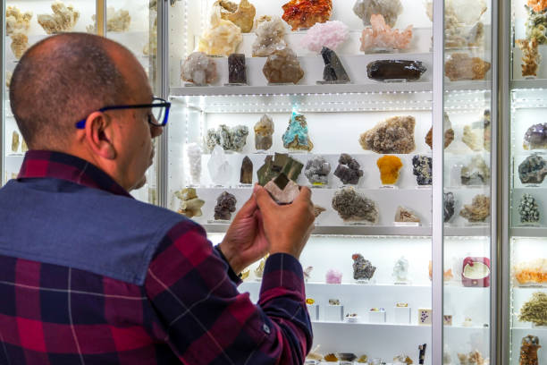 istock Geologist examines a large crsital pit in its matrix 2196438649