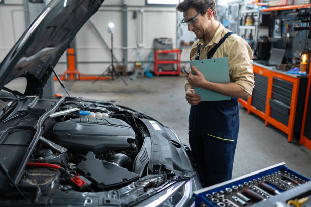 istock Joyful automotive technician standing at the service station 2196439101