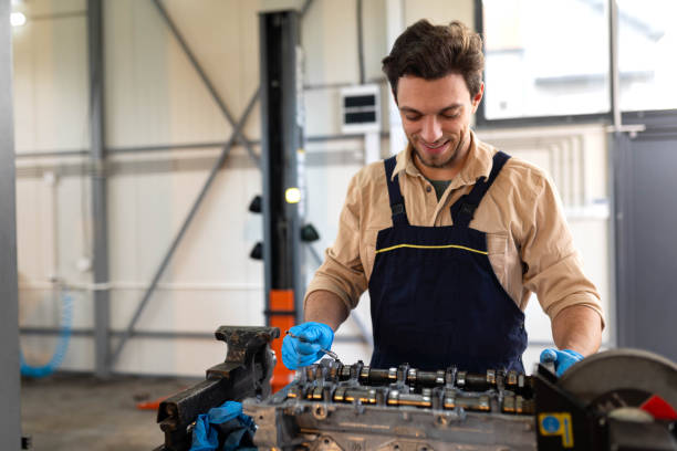 istock Mechanic repairing a valve engine 2196439252