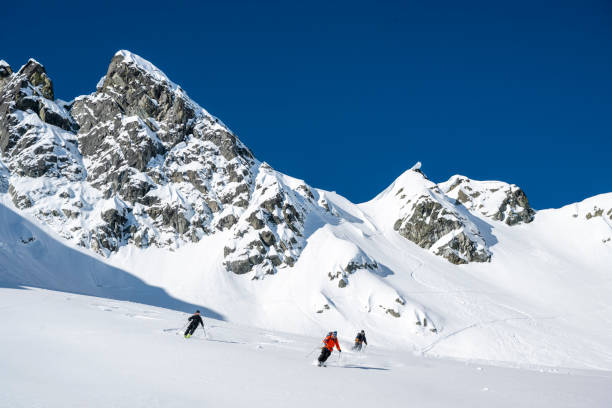 istock Group of backcountry skiers descend mountain 2196439421