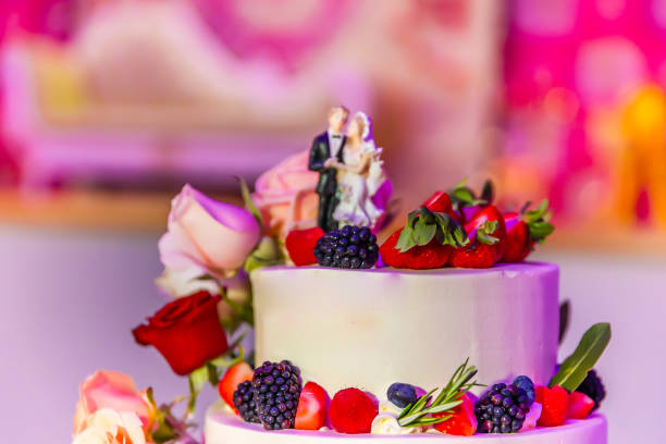 istock Beautiful creamy white wedding cake decorated with flowers 2196439544