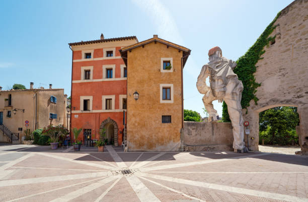 Capena, Lazio Italy - June 8, 2024: Town square with sculpture called Il Momento by Ervin Lorianth Hervé (2018) in the historic district of Capena in the Metropolitan City of Rome.