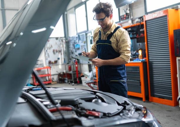 istock Joyful automotive technician standing at the service station 2196439640