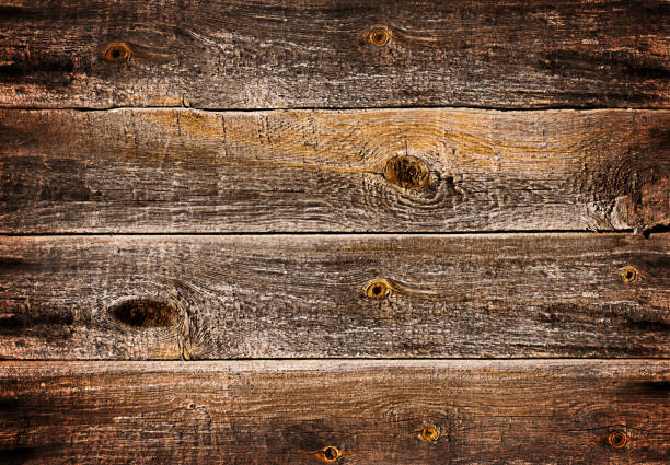 The dark brown wooden background