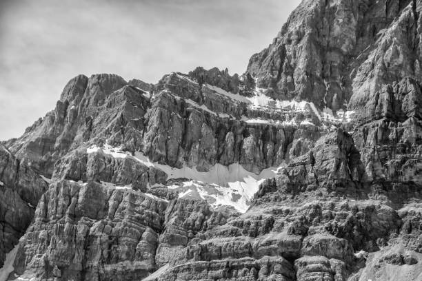 A grayscale of a rugged mountain covered in snow in Utah