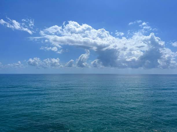 istock Ocean calm water and cloudy heaven horizon. 2196441940