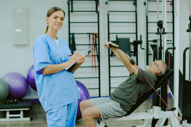 istock Smiling Doctor in Rehab Center 2196442516