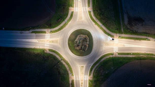 istock traffic roundabout in the night aerial view 2196444126