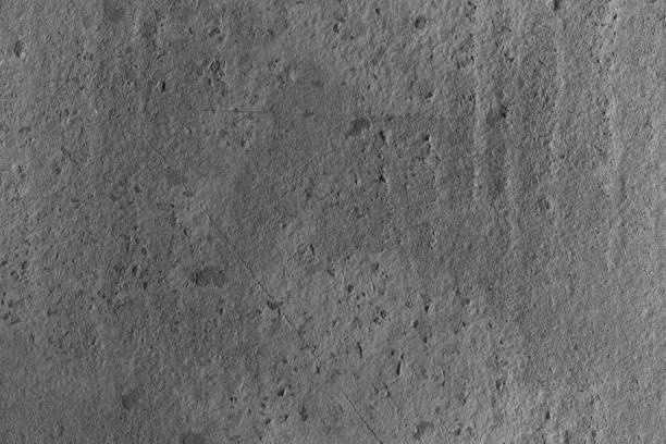 Rough concrete surface displays textures and small imperfections in gray hues.