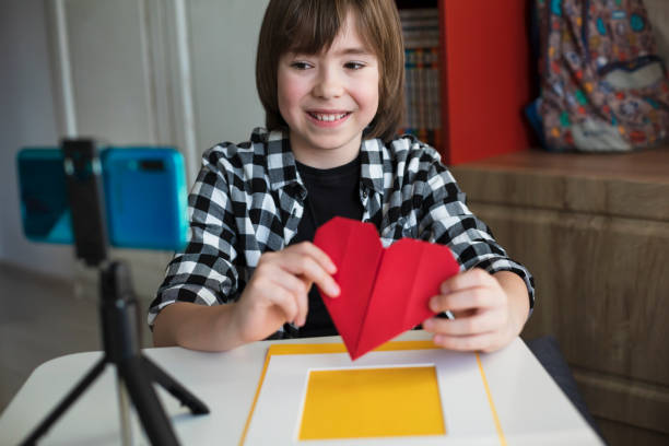 istock Happy kid live streaming for his DIY craft channel 2196447847