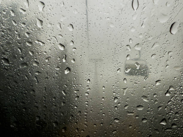istock Raindrops on a Window Overlooking a Chairlift at a Rainy Ski Resort 2196448007