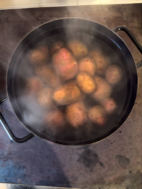 istock Boiling Potatoes in a Steaming Black Pot 2196448081