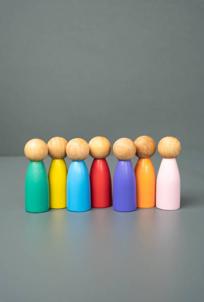istock Multi-colored figures of people stand in a row. Multiculturalism and diversity. Standing united. Celebrating unique identities, fostering global unity, and embracing diversity in modern societies. 2196448523
