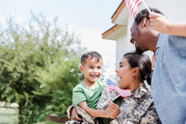 istock Happy Multiracial Family Welcomes Soldier Home 2196449310
