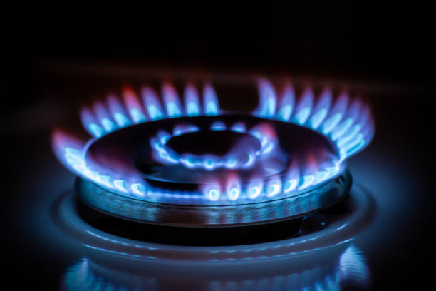 istock Gas stove burner with blue flame in dark 2196450250